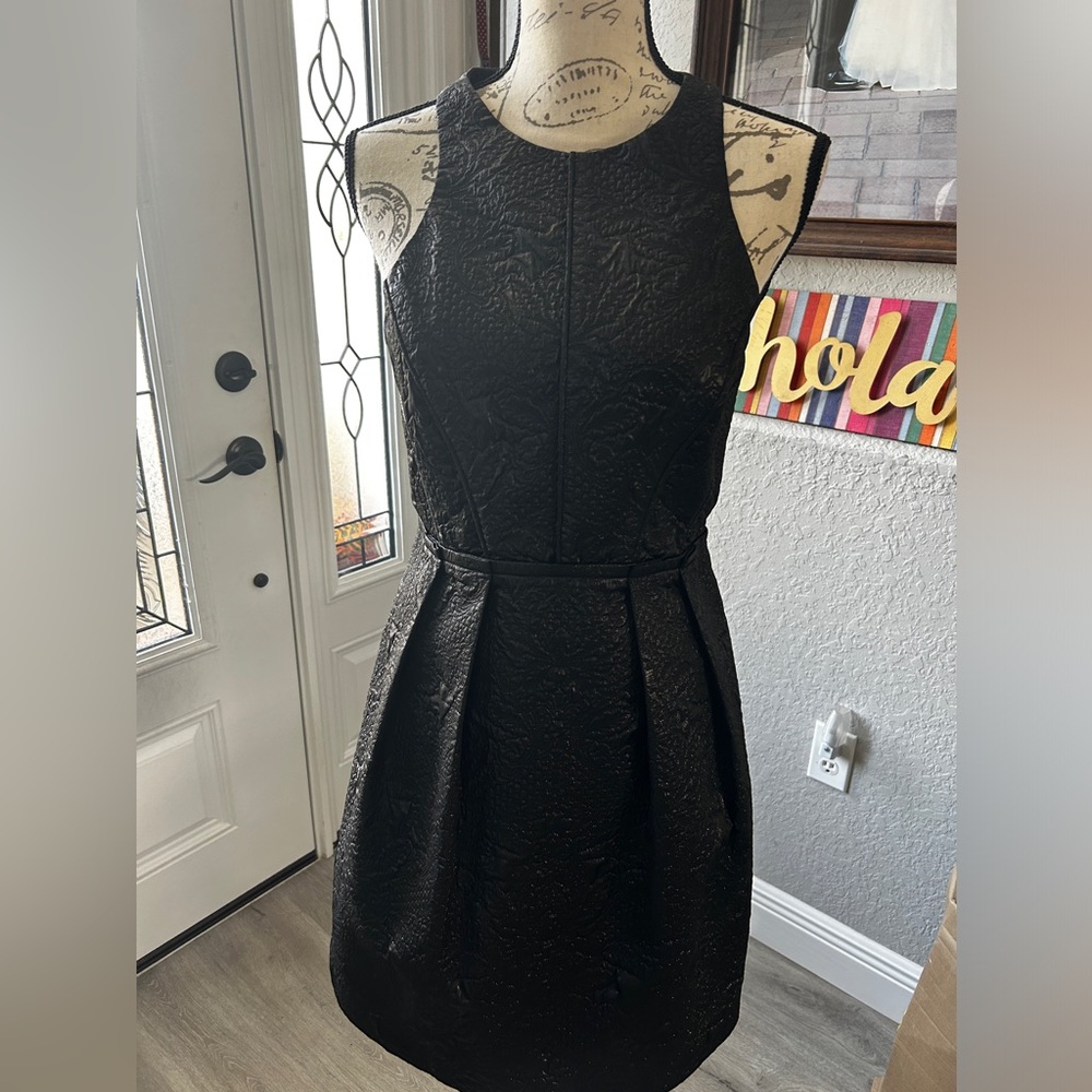 The perfect LBD Halter dress with “engraved” design on fabric.